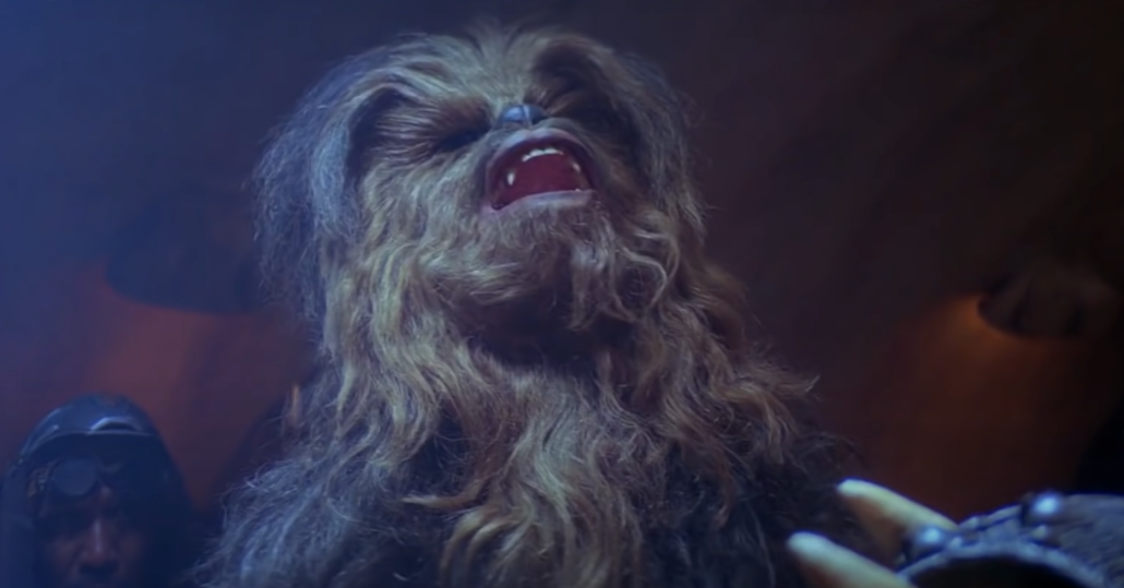 Chewbacca in Star Wars with opened mouth looking above