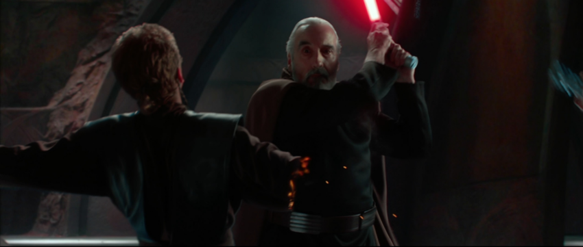 Jedi with a sword in his hands cuts off Anakin's hand